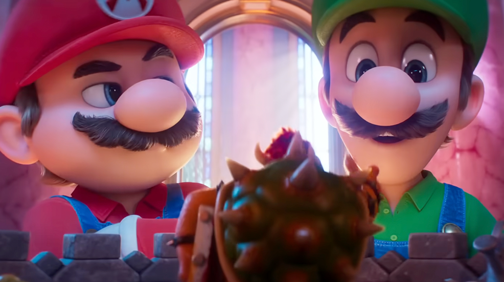 Mario and Luigi looming over a shrunken down Bowser in the Super Mario Galaxy Movie